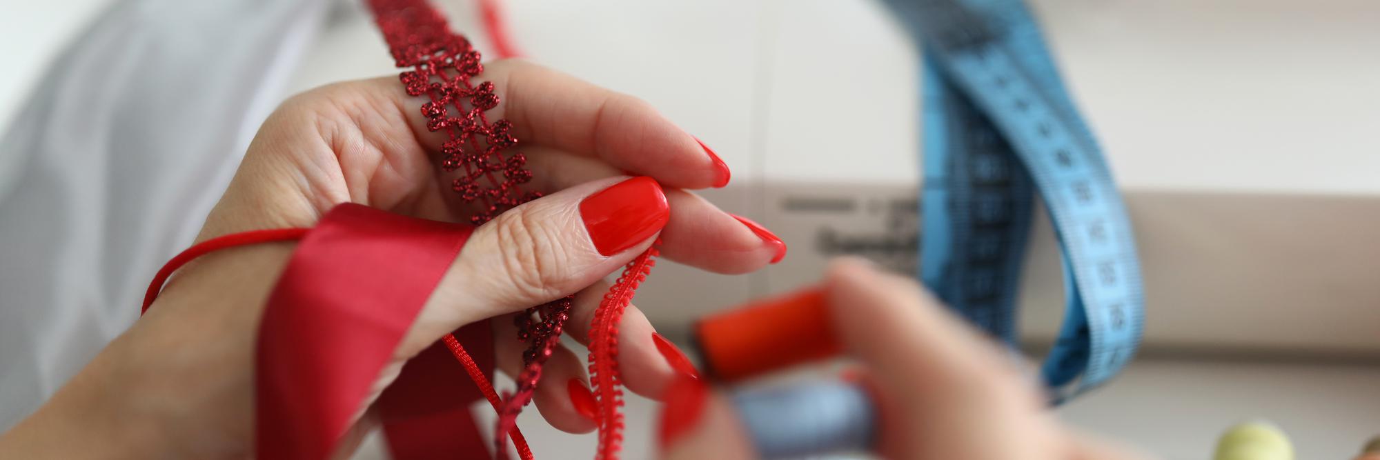 Instructor demonstrating ribbon embroidery in studio